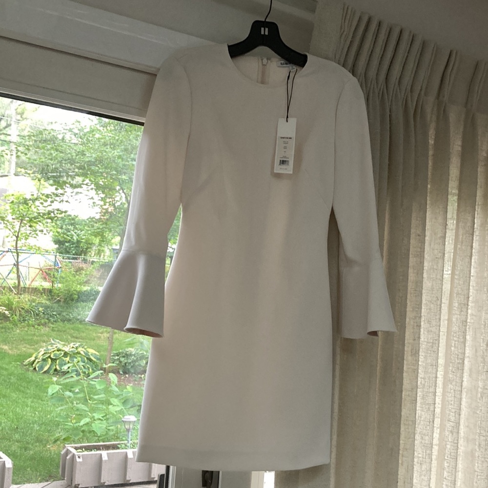 Ivory/White tailored feminine dress with bell sleeves. With original tags.